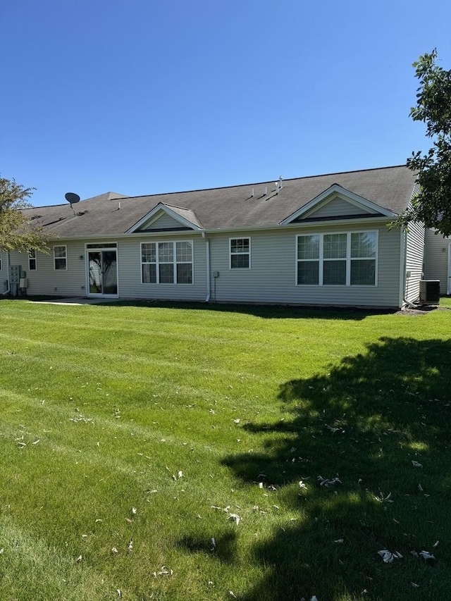13370 Red Alder Ave, Huntley, IL 60142 - rear view of property featuring a lawn and central AC unit