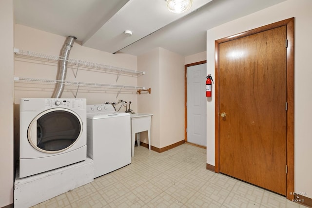 35976 N Fairfield Rd, Ingleside, IL 60041 - laundry room featuring washer and dryer, baseboards, and light flooring