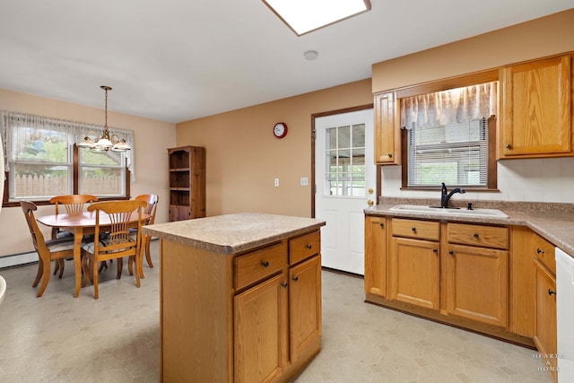 35976 N Fairfield Rd, Ingleside, IL 60041 - kitchen featuring a sink, light flooring, decorative light fixtures, and a kitchen island