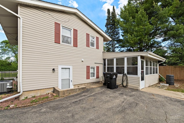 35976 N Fairfield Rd, Ingleside, IL 60041 - view of front of property with a sunroom, cooling unit, and fence