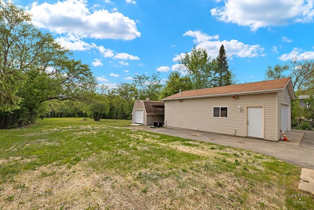 35976 N Fairfield Rd, Ingleside, IL 60041 - view of green lawn with an outbuilding, a garage, and a storage shed