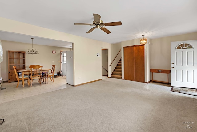 35976 N Fairfield Rd, Ingleside, IL 60041 - living room with a chandelier, light colored carpet, stairway, ceiling fan, and baseboards