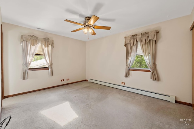 35976 N Fairfield Rd, Ingleside, IL 60041 - carpeted empty room featuring a baseboard radiator, plenty of natural light, a ceiling fan, and baseboards