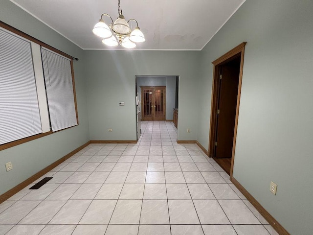 1934 W 21st Pl, Chicago, IL 60608 - unfurnished dining area featuring a chandelier, baseboards, and light tile patterned floors