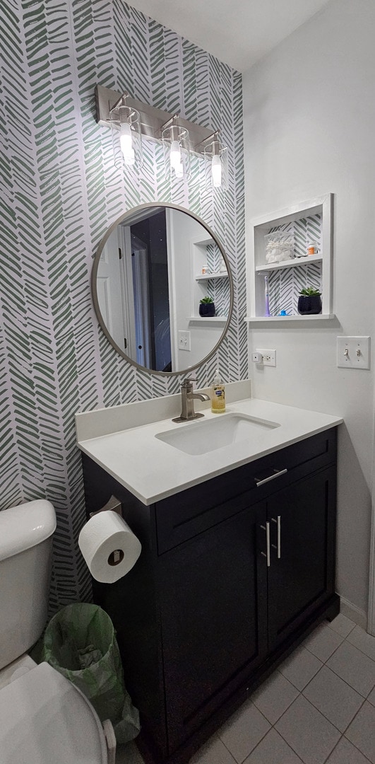 2383 Shiloh Dr, Aurora, IL 60503 - half bath featuring vanity, wallpapered walls, and tile patterned floors