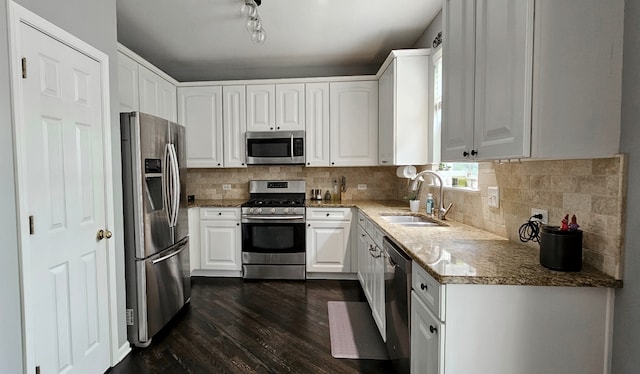 2383 Shiloh Dr, Aurora, IL 60503 - kitchen featuring appliances with stainless steel finishes, dark wood finished floors, white cabinets, light stone counters, and tasteful backsplash