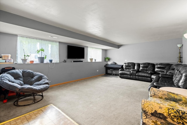 carpeted living area featuring baseboards
