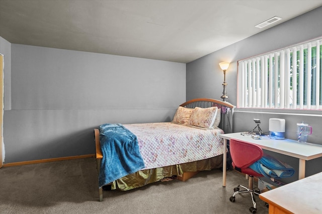 bedroom featuring carpet and baseboards