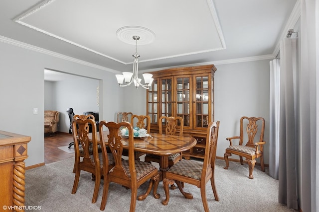 1847 Lake Shore Dr, Romeoville, IL 60446 - dining area with a chandelier, baseboards, carpet, crown molding, and a raised ceiling