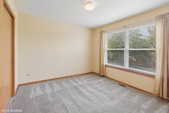 1847 Lake Shore Dr, Romeoville, IL 60446 - spare room with light colored carpet and baseboards