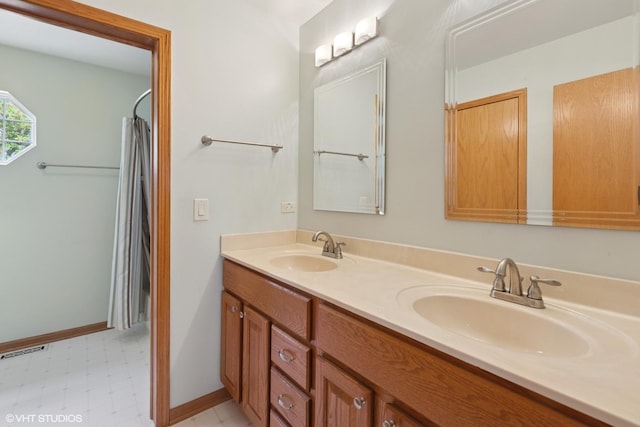 1847 Lake Shore Dr, Romeoville, IL 60446 - full bathroom featuring double vanity, baseboards, tile patterned floors, and curtained shower