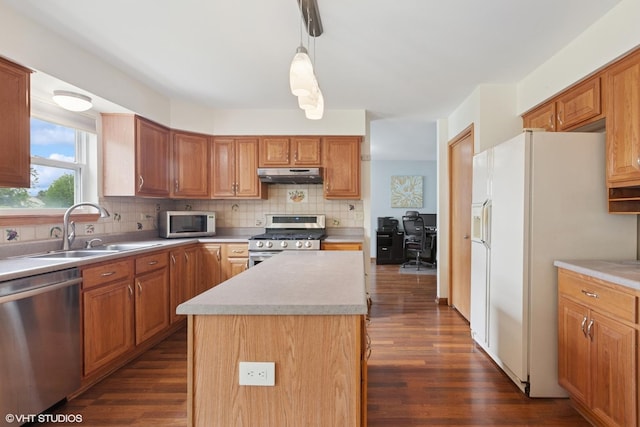 1847 Lake Shore Dr, Romeoville, IL 60446 - kitchen with stainless steel appliances, under cabinet range hood, a sink, dark wood-style flooring, and light countertops
