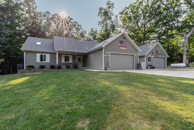 21 Carribean Dr, Putnam, IL 61560 - ranch-style house featuring driveway, a front yard, an attached garage, and roof with shingles