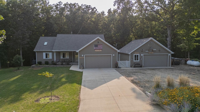 21 Carribean Dr, Putnam, IL 61560 - view of front facade with driveway, a shingled roof, and an attached garage
