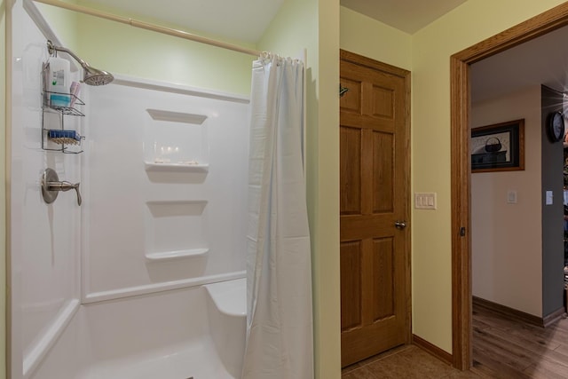21 Carribean Dr, Putnam, IL 61560 - full bath with a shower with curtain, baseboards, and wood finished floors