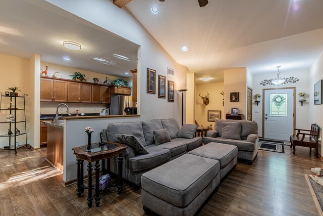 21 Carribean Dr, Putnam, IL 61560 - living room featuring dark wood finished floors, vaulted ceiling, and recessed lighting