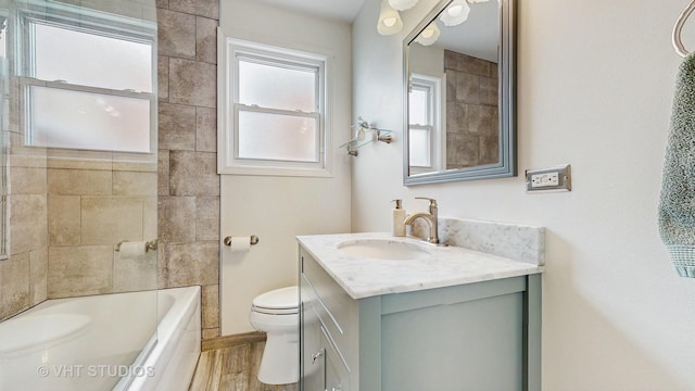 5304 N Oriole Ave, Chicago, IL 60656 - full bathroom with toilet, vanity,  shower combination, and wood finished floors