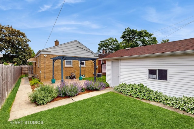 5304 N Oriole Ave, Chicago, IL 60656 - rear view of property featuring a pergola, a patio area, central AC unit, and brick siding