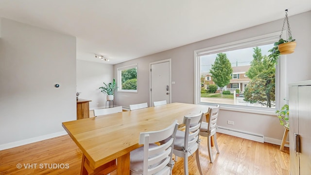 5304 N Oriole Ave, Chicago, IL 60656 - dining area featuring a baseboard radiator, light wood finished floors, and baseboards