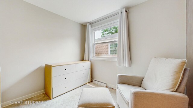 5304 N Oriole Ave, Chicago, IL 60656 - sitting room featuring baseboards, carpet, and a baseboard heating unit