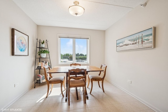 6807 N Milwaukee Ave Unit 204, Niles, IL 60714 - dining room with baseboards and light tile patterned floors
