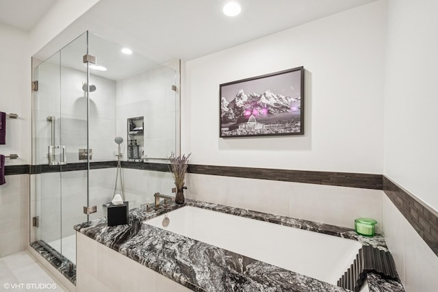 6807 N Milwaukee Ave Unit 204, Niles, IL 60714 - full bath featuring a shower stall, recessed lighting, and a garden tub