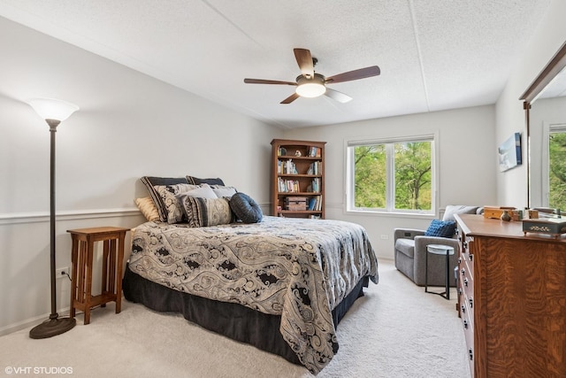 6807 N Milwaukee Ave Unit 204, Niles, IL 60714 - bedroom featuring light carpet, a ceiling fan, and baseboards