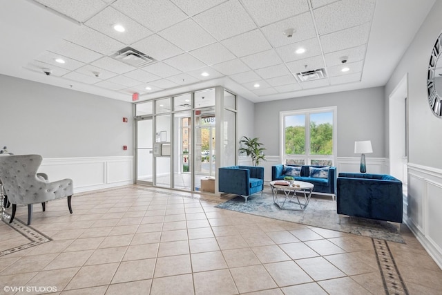 6807 N Milwaukee Ave Unit 204, Niles, IL 60714 - community lobby featuring a drop ceiling, wainscoting, a decorative wall, a surveillance system, and recessed lighting