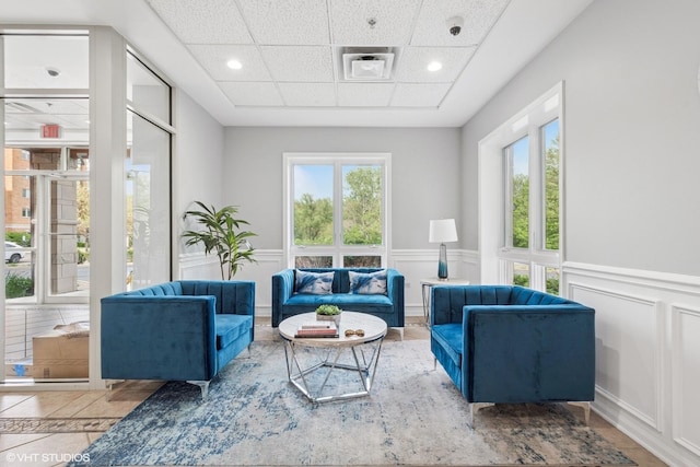 6807 N Milwaukee Ave Unit 204, Niles, IL 60714 - building lobby featuring wainscoting, a decorative wall, a drop ceiling, a security system, and recessed lighting
