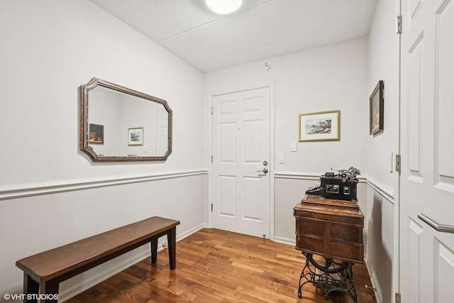 6807 N Milwaukee Ave Unit 204, Niles, IL 60714 - entrance foyer with light wood-style floors and baseboards