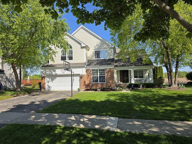 7943 Dada Dr, Gurnee, IL 60031 - traditional-style home with driveway, an attached garage, brick siding, a front yard, and covered porch