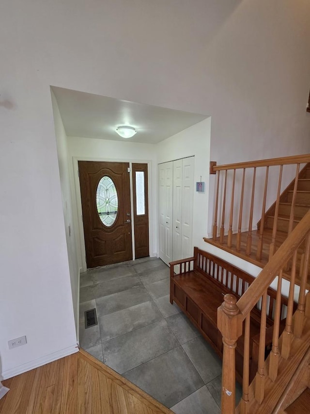 7943 Dada Dr, Gurnee, IL 60031 - foyer entrance featuring stairway and baseboards