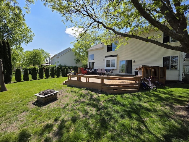 7943 Dada Dr, Gurnee, IL 60031 - back of house with a fire pit, a yard, and a wooden deck