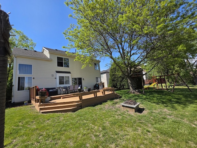 7943 Dada Dr, Gurnee, IL 60031 - rear view of property with a lawn, a deck, a playground, and an outdoor living space with a fire pit