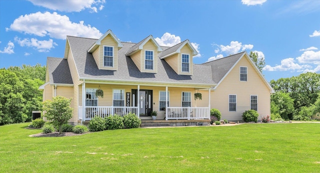 1228 N County Road 530 Rd E, Tuscola, IL 61953 - cape cod home featuring a porch, a front yard, and roof with shingles