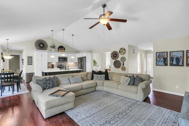 1228 N County Road 530 Rd E, Tuscola, IL 61953 - living area with dark wood-style flooring, ceiling fan, and high vaulted ceiling
