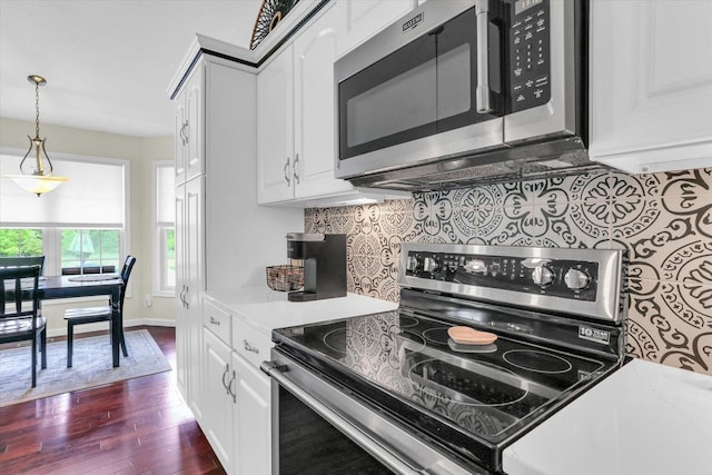1228 N County Road 530 Rd E, Tuscola, IL 61953 - kitchen with stainless steel appliances, decorative backsplash, light countertops, and white cabinets