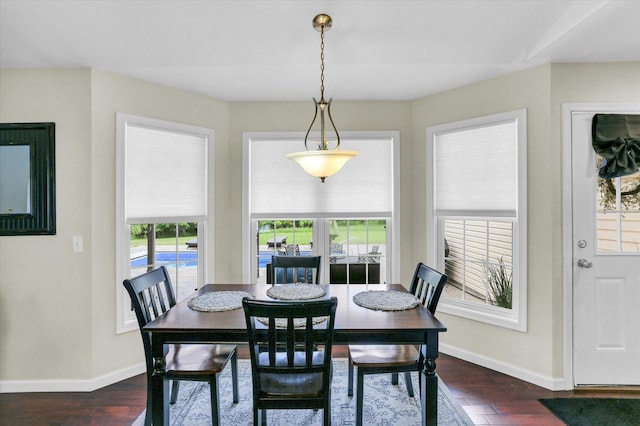 1228 N County Road 530 Rd E, Tuscola, IL 61953 - dining area featuring dark wood-type flooring and baseboards