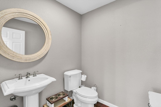 1228 N County Road 530 Rd E, Tuscola, IL 61953 - half bathroom with toilet and wood finished floors
