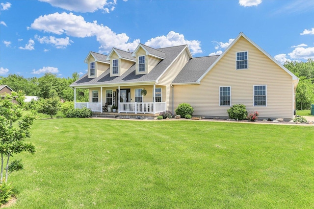 1228 N County Road 530 Rd E, Tuscola, IL 61953 - new england style home with a porch, a front lawn, and a shingled roof