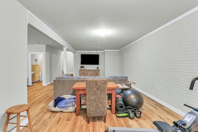 1228 N County Road 530 Rd E, Tuscola, IL 61953 - interior space featuring wood finished floors and brick wall