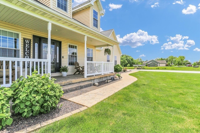 1228 N County Road 530 Rd E, Tuscola, IL 61953 - property entrance featuring a porch and a yard