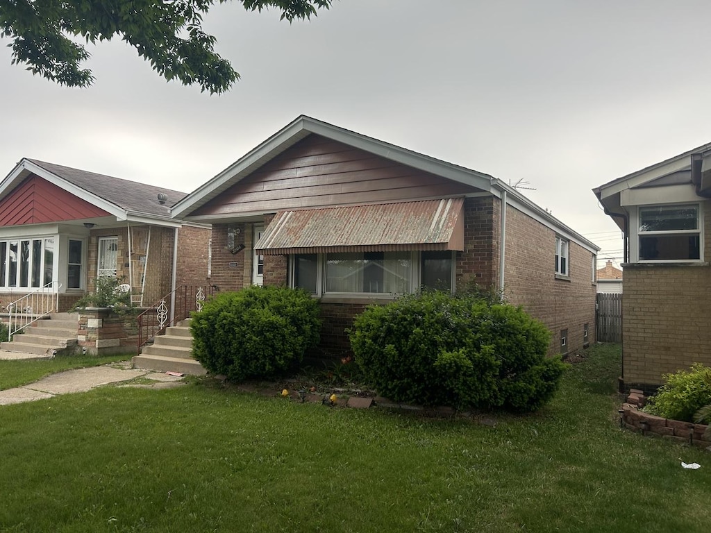 3506 W 78th St, Chicago, IL 60652 - view of front of property with brick siding and a front yard