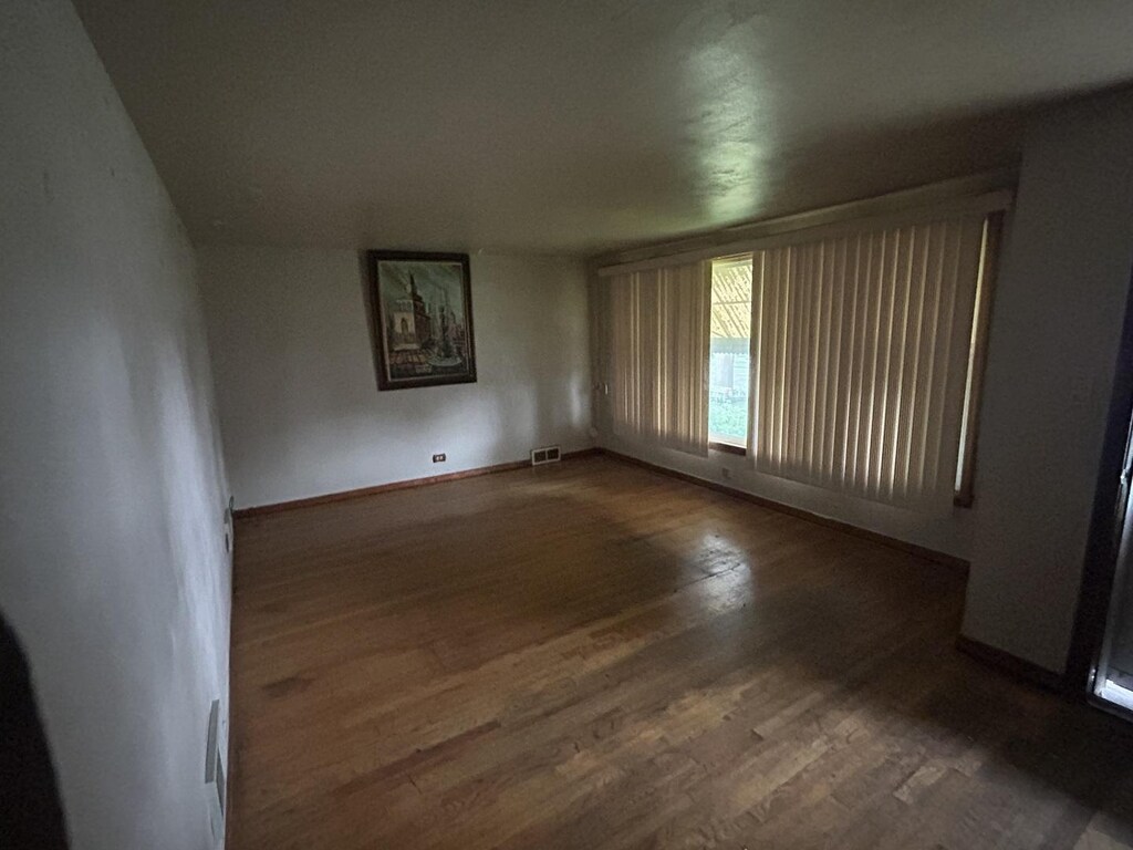 3506 W 78th St, Chicago, IL 60652 - unfurnished room with wood finished floors and baseboards