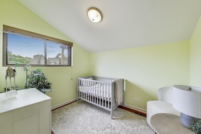 847 N Damen Ave Unit 2R, Chicago, IL 60622 - bedroom with lofted ceiling, a nursery area, and light wood-style floors
