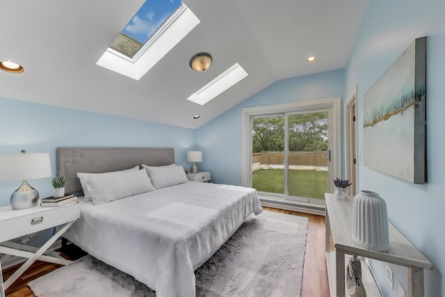 847 N Damen Ave Unit 2R, Chicago, IL 60622 - bedroom with a skylight, wood finished floors, vaulted ceiling, and recessed lighting