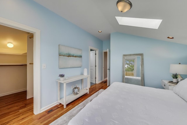 847 N Damen Ave Unit 2R, Chicago, IL 60622 - bedroom with a skylight, wood finished floors, and lofted ceiling