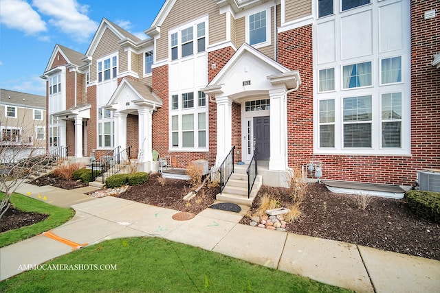 863 Lewisburg Ln, Aurora, IL 60504 - townhome / multi-family property with brick siding and central AC unit