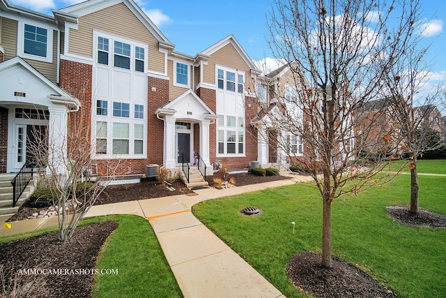 863 Lewisburg Ln, Aurora, IL 60504 - view of property featuring brick siding and a front yard