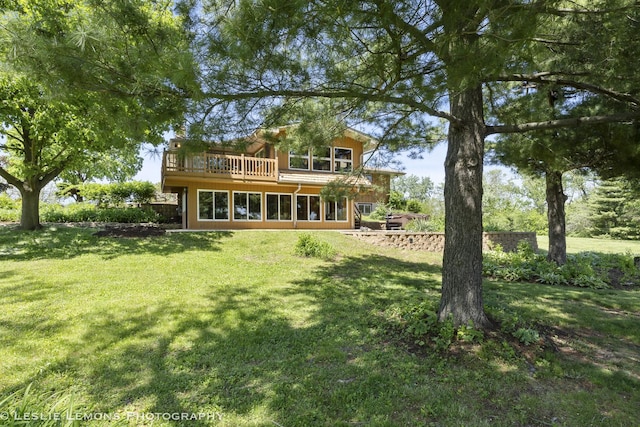 back of house with a yard